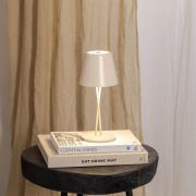 Lindby LED uppladdningsbar bordslampa Janea, CROSS, beige, metall