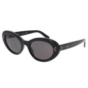 Celine Ovala solglasögon med svart acetatram och grå organiska linser ...