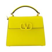 Valentino Garavani Grained leather handbag with adjustable strap Yello...