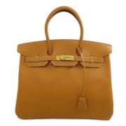 Hermès Vintage Pre-owned Laeder handvskor Beige, Dam