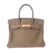 Hermès Vintage Pre-owned Laeder handvskor Beige, Dam