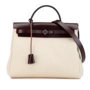 Hermès Vintage Pre-owned Canvas handvskor Beige, Dam