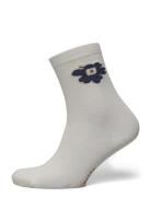 Makeinen Unikko Sockor Strumpor Cream Marimekko